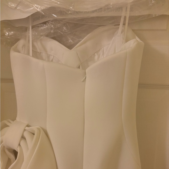 Jovani size 8 Strapless white gown with slit, side bow, and small tail. - Picture 7 of 10
